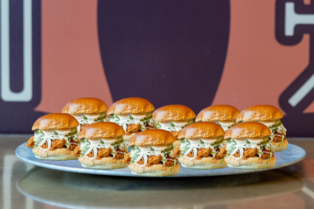 Multiple Barn Bird Kitchen chicken sandos prepared for a large order