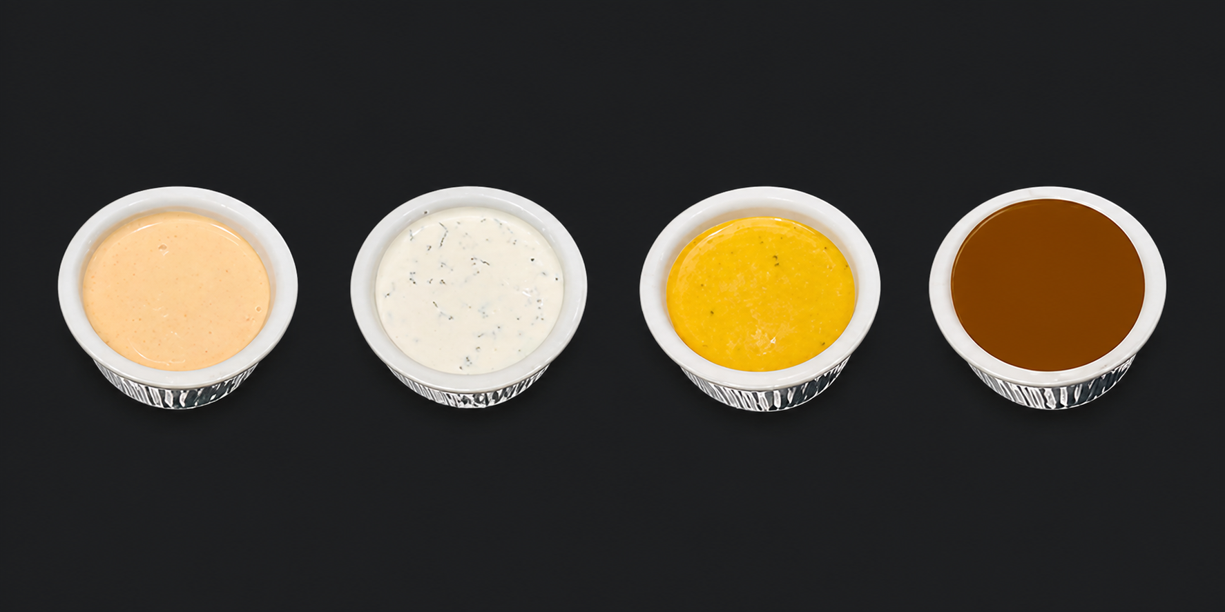 Barn Bird Kitchen's four house sauces: Barn Bird Sauce, Buttermilk Ranch, Maple Mustard, and Honey Butter